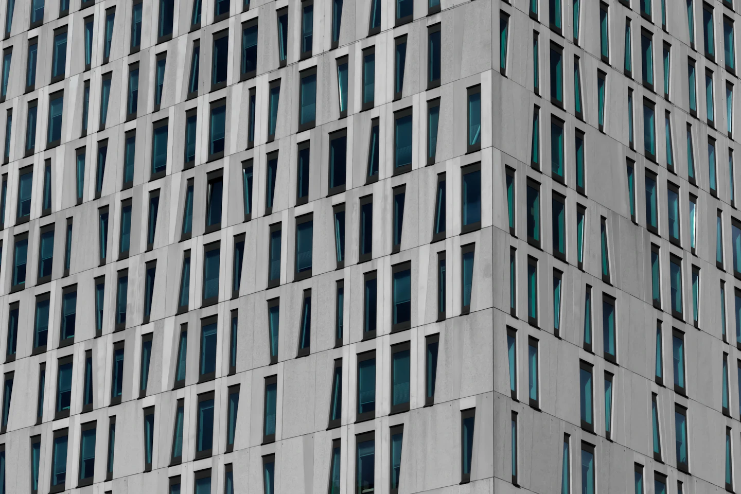 Grid of windows across a commercial building façade