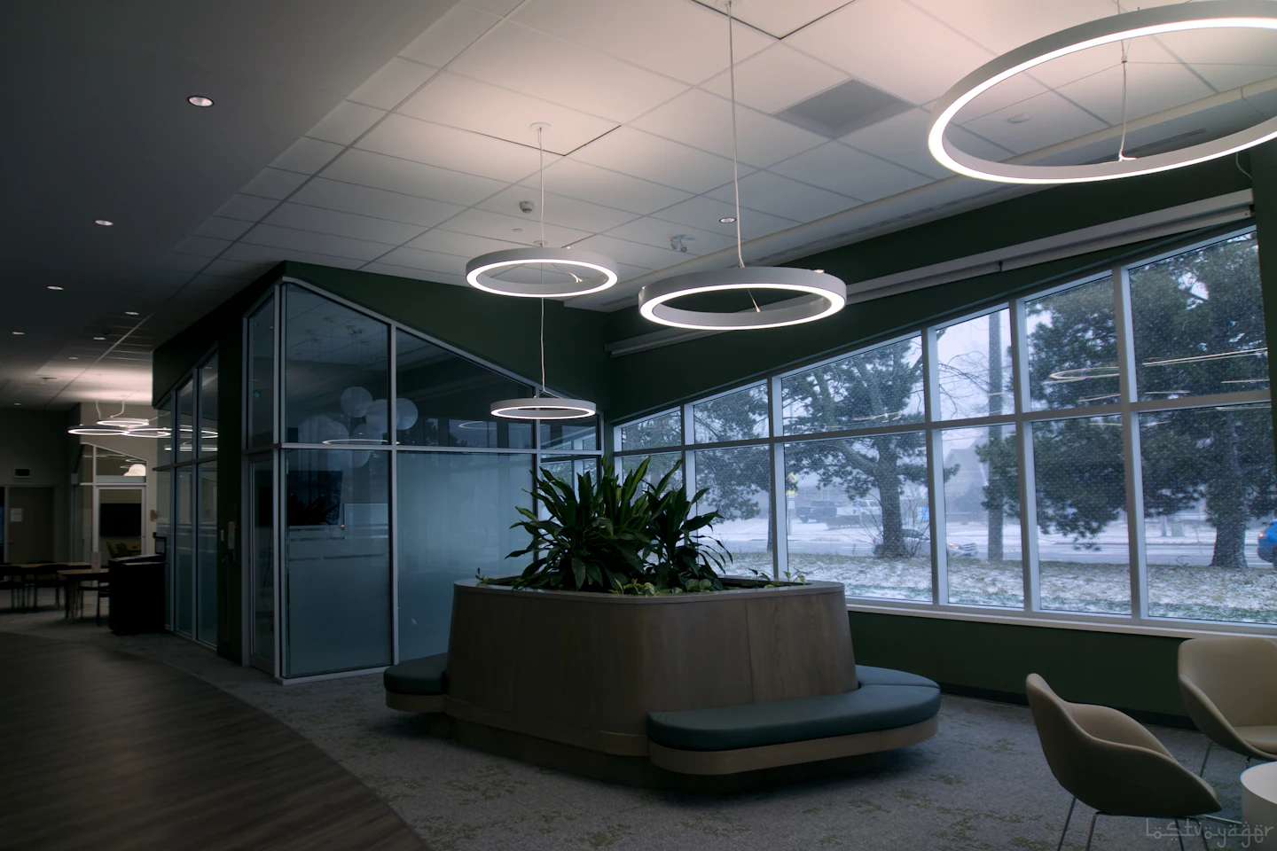 Contemporary office lobby with deep interior space and large windows